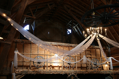 white tulle decorating a barn wedding