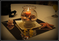 beach centerpiece with candles and shells