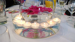 floating candle centerpiece with gerbera daisies