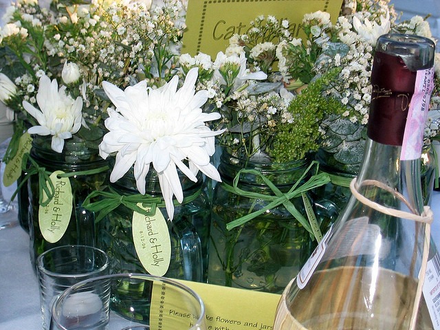 jars filled with white flowers
