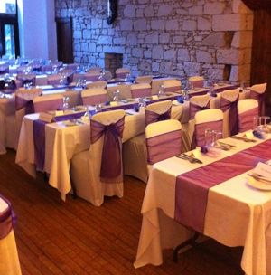 wedding tables with purple table runners