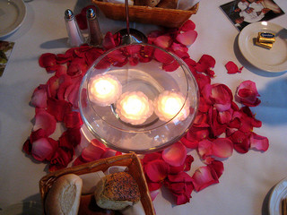 Red Rose petals could also add a splash of color to your tables