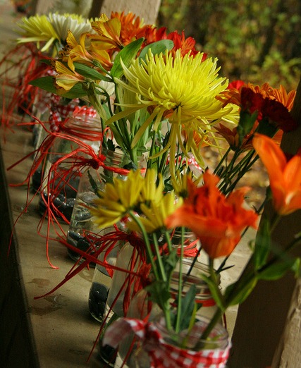 orange yellow flowers for rustic wedding centerpiece
