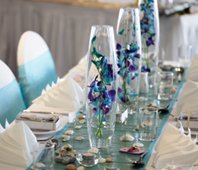 Blue Orchid Centerpieces would look fab for your theme.